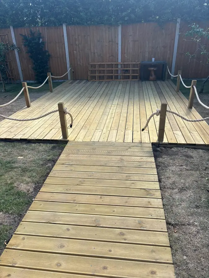 Timber deck with rope post detail and a boardwalk leading up to it