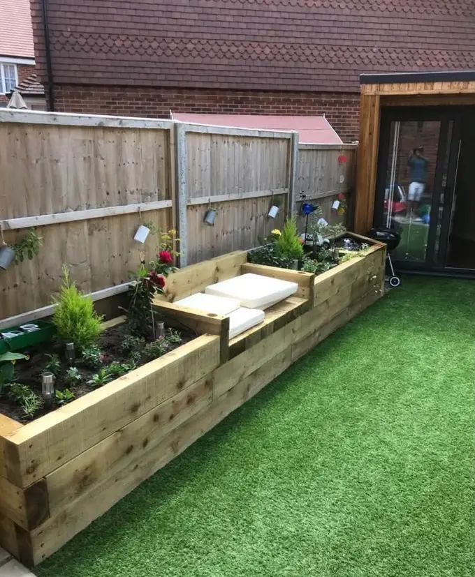 Sleeper raised beds with planting and artificial grass
