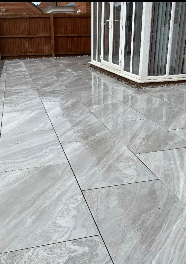 Polished grey porcelain patio outside French doors