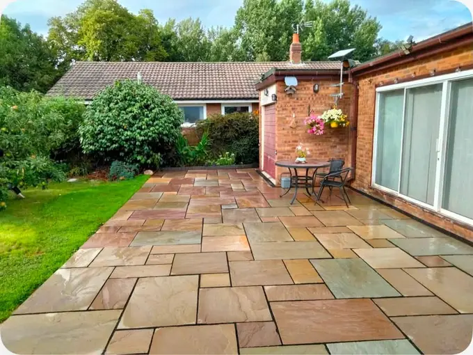 Indian stone patio outside a bungalow with bistro table