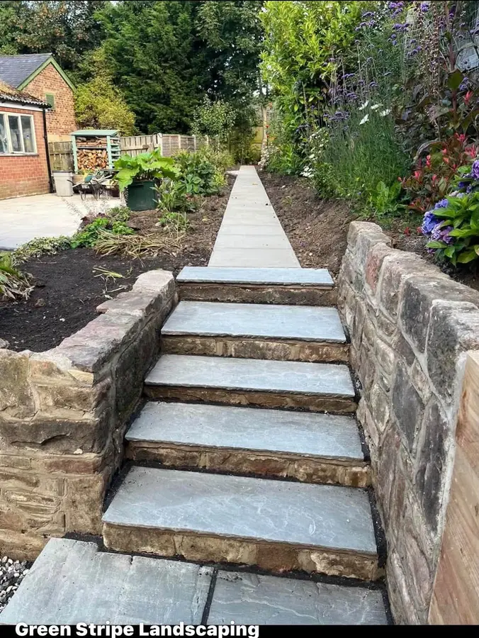 Stone garden steps set between drystone retaining walls